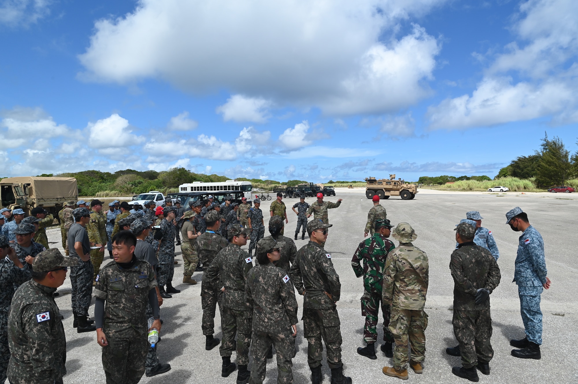 U.S. Air Force Master Sgt. Russell Wrenn, heavy repair section chief assigned to 554th RED HORSE Squadron, briefs partner nations during Silver Flag on Northwest Field, Guam, June 30, 2022.