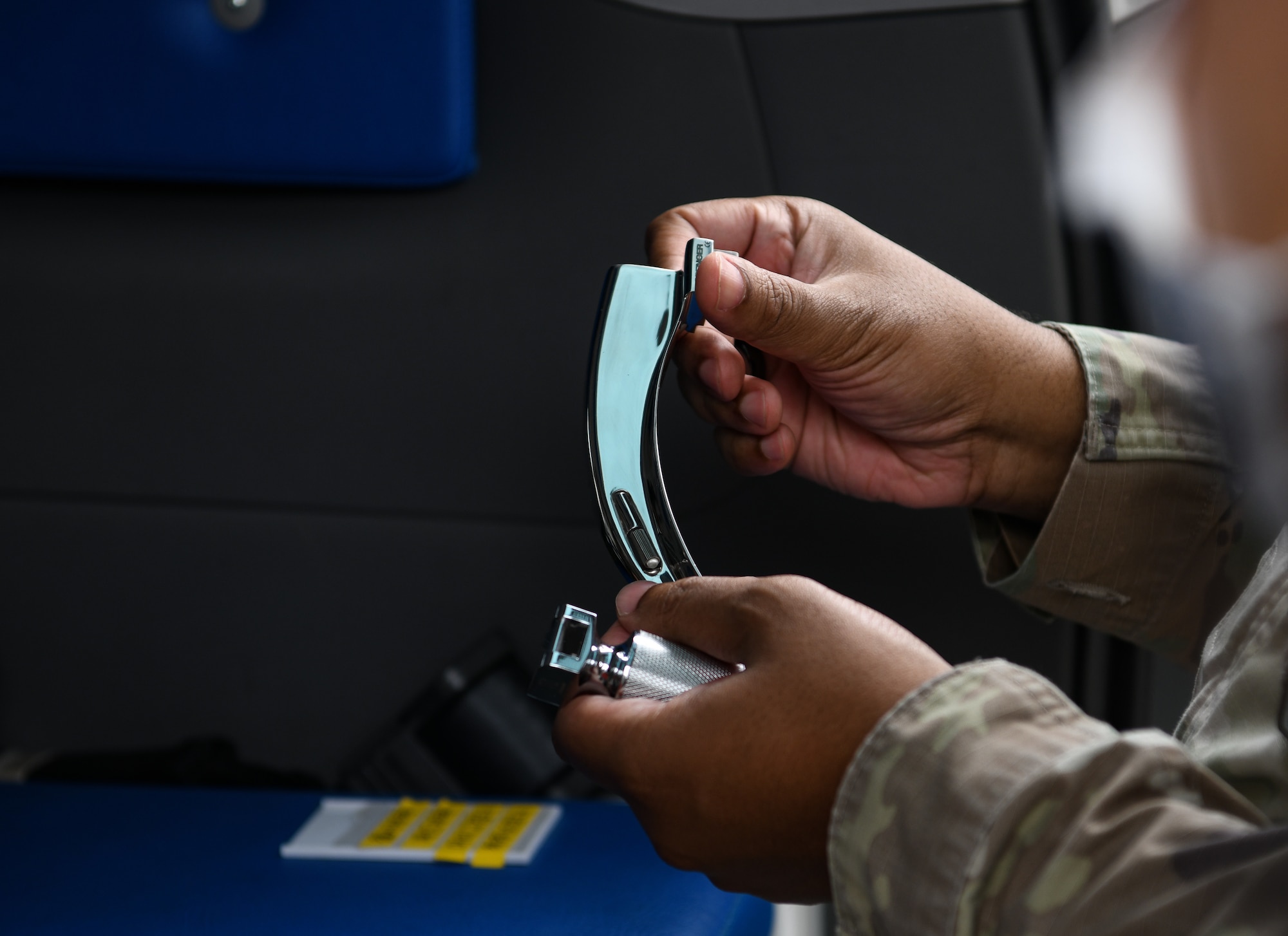 U.S. Air Force Maj. Eugene Harris, 8th Medical Group chief of education and infection prevention, shows a medical tool, during a Republic of Korea and U.S. medical immersion training at Kunsan Air Base, Republic of Korea, July 19, 2022. Immersion trainings provide opportunities for U.S. and ROKAF members to work interoperability and enhance future mission fluidity. (U.S. Air Force photo by Staff Sgt. Sadie Colbert)