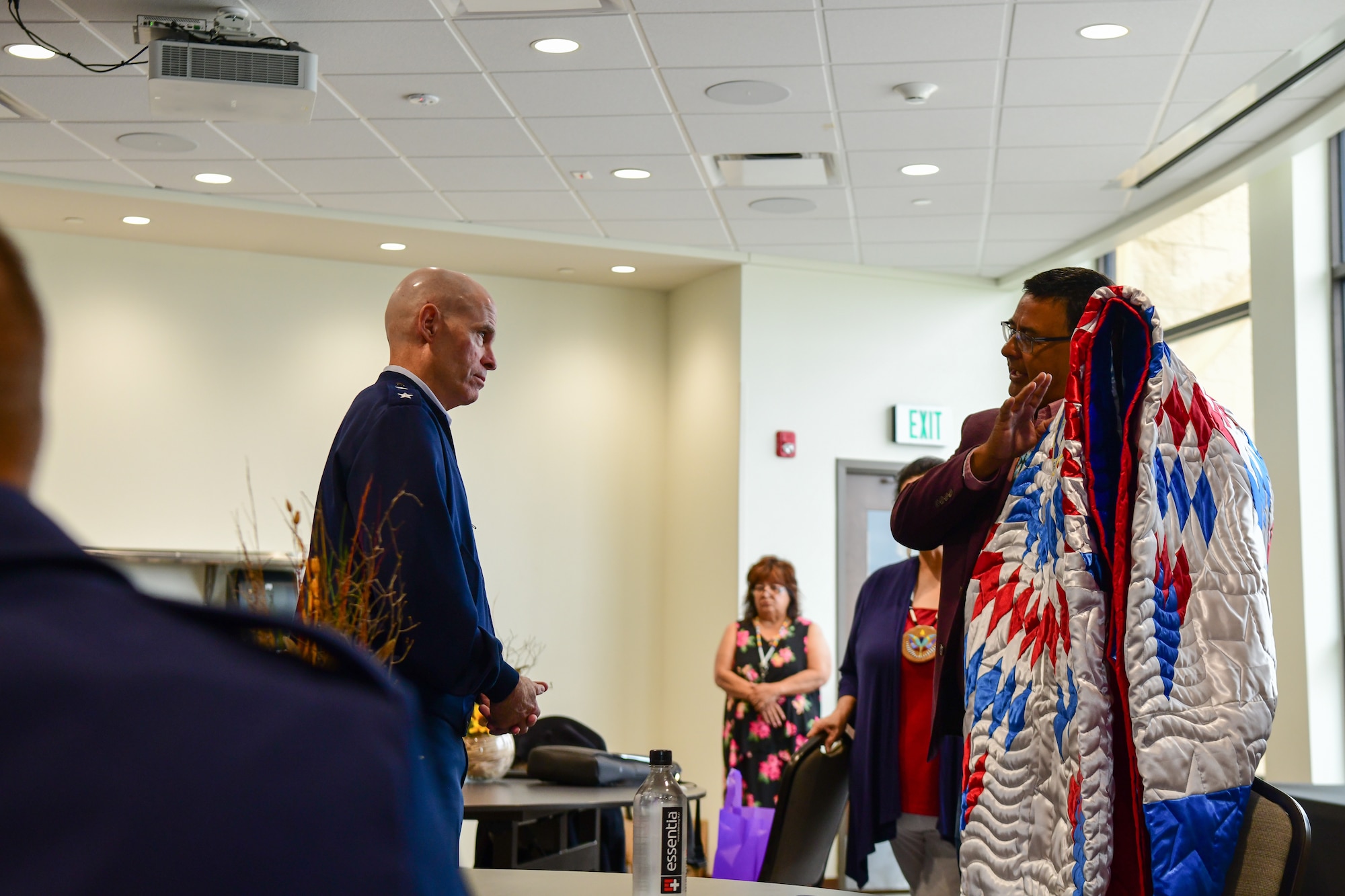 Maj Gen. Michael Lutton, Twentieth Air Force commander and Three Affiliated Tribes Chairman Mark Fox exchange gifts at Fort Berthold Reservation New Town, N.D. July 19, 2022.