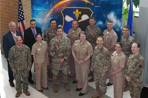 Members of FNMOC (Fleet Numerical Meteorological and Oceanographic Center) and FWC (Fleet Weather Center) are meeting with 557 WW.  The Group Photo will commemorate their visit and be distributed between the AF and Navy.