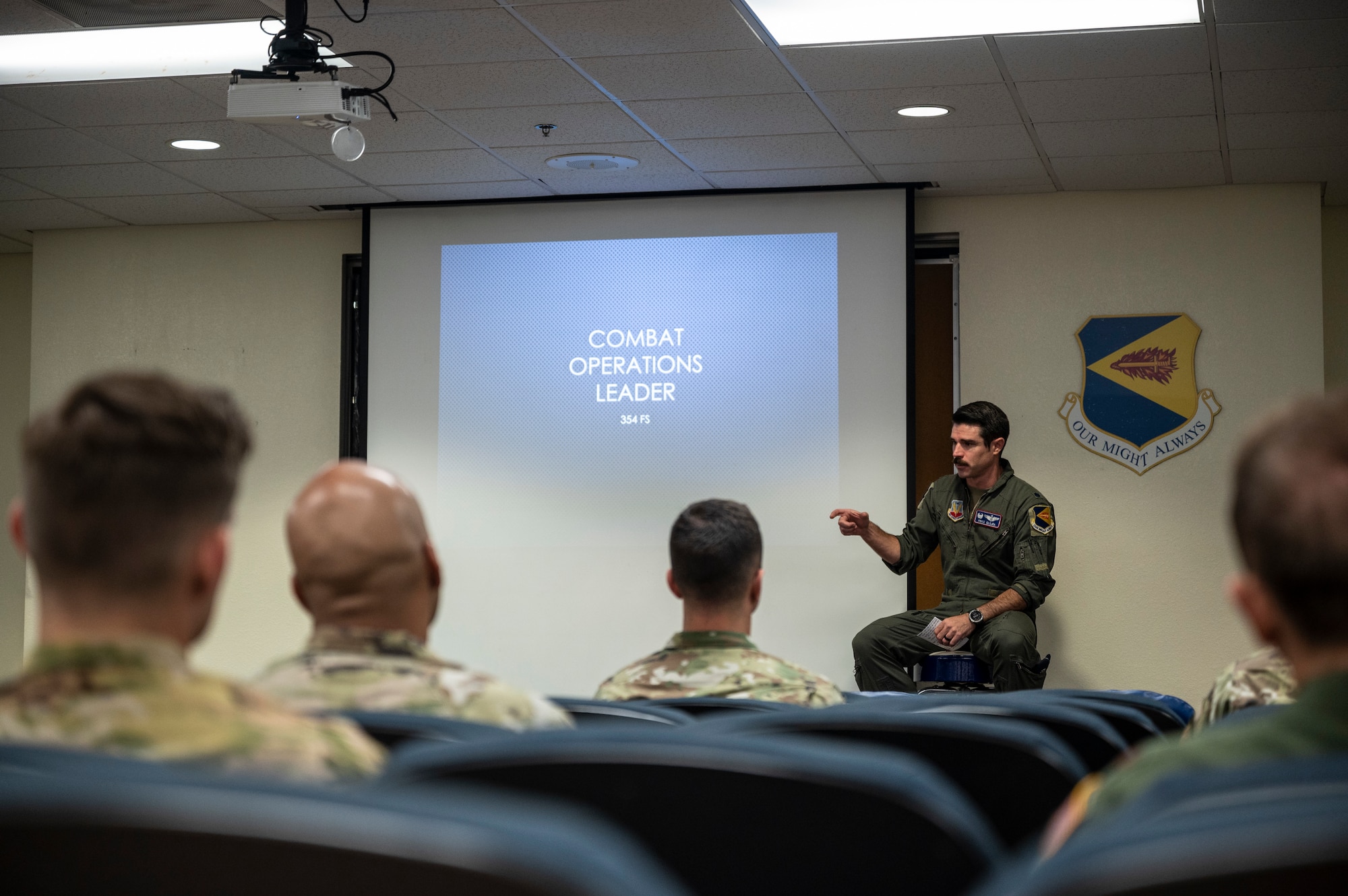 A photo of an Airman teaching a class