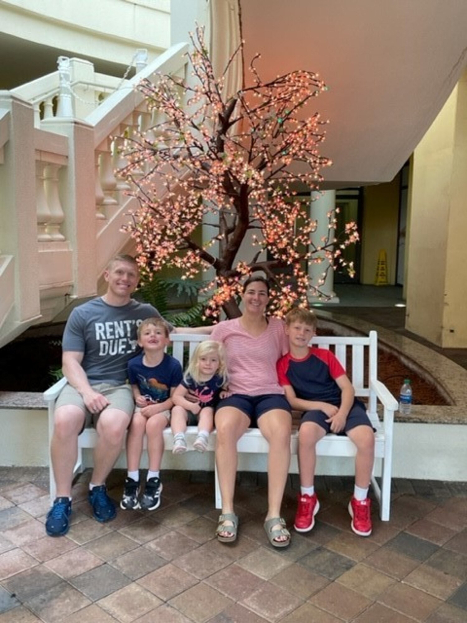 U.S. Air Force Lt. Col. Jennifer Johnson, 17th Healthcare Operations Squadron commander, sits with her husband Lt. Col. Jeremiah Johnson and their children: Mason, Isaac, and Maggie. In 2021, they spent time together as a family in Destin, Florida for Christmas and New Year’s. (Courtesy Photo)