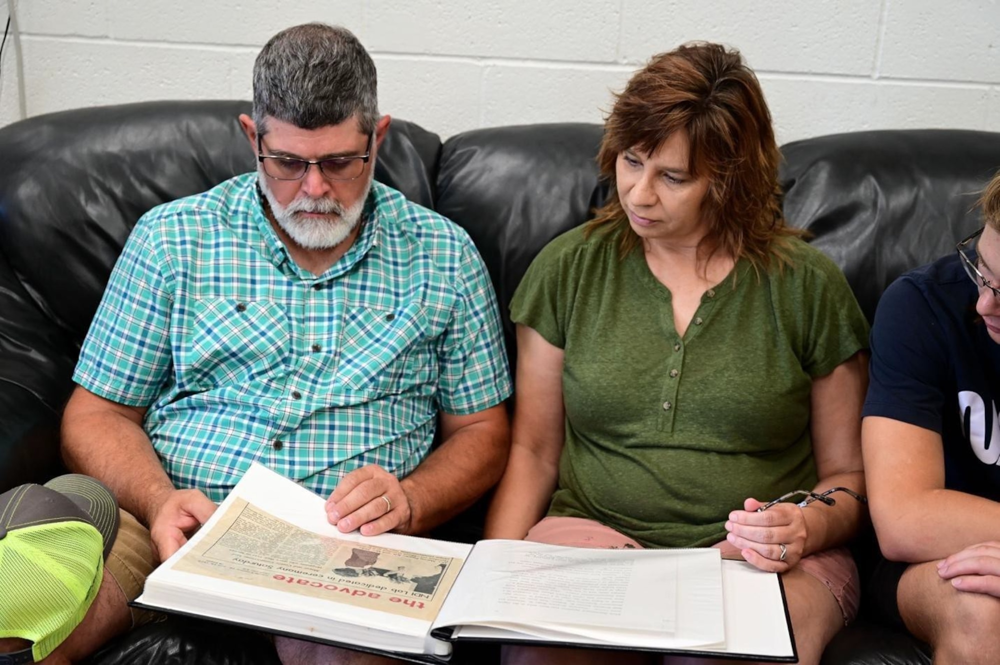 Marvin Pepper and his wife, Becky, look through a photo album dedicated to Marvin’s Father, Staff Sgt. Marvin Eugene Pepper, at Ellsworth Air Force Base, S.D., July 13, 2022.
