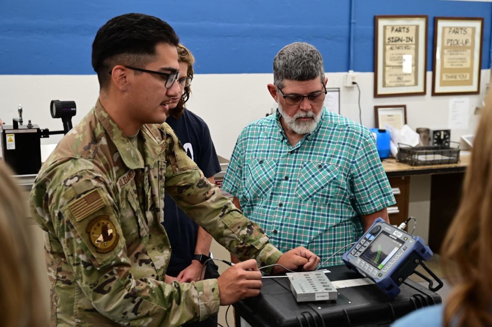 Marvin Pepper and his family are given a tour of the Non-Destructive Inspection laboratory by Airman 1st Class Melvin Gondalez, a 28th Maintenance Squadron Fabrication Flight NDI apprentice, at Ellsworth Air Force Base, S.D., July 13, 2022.