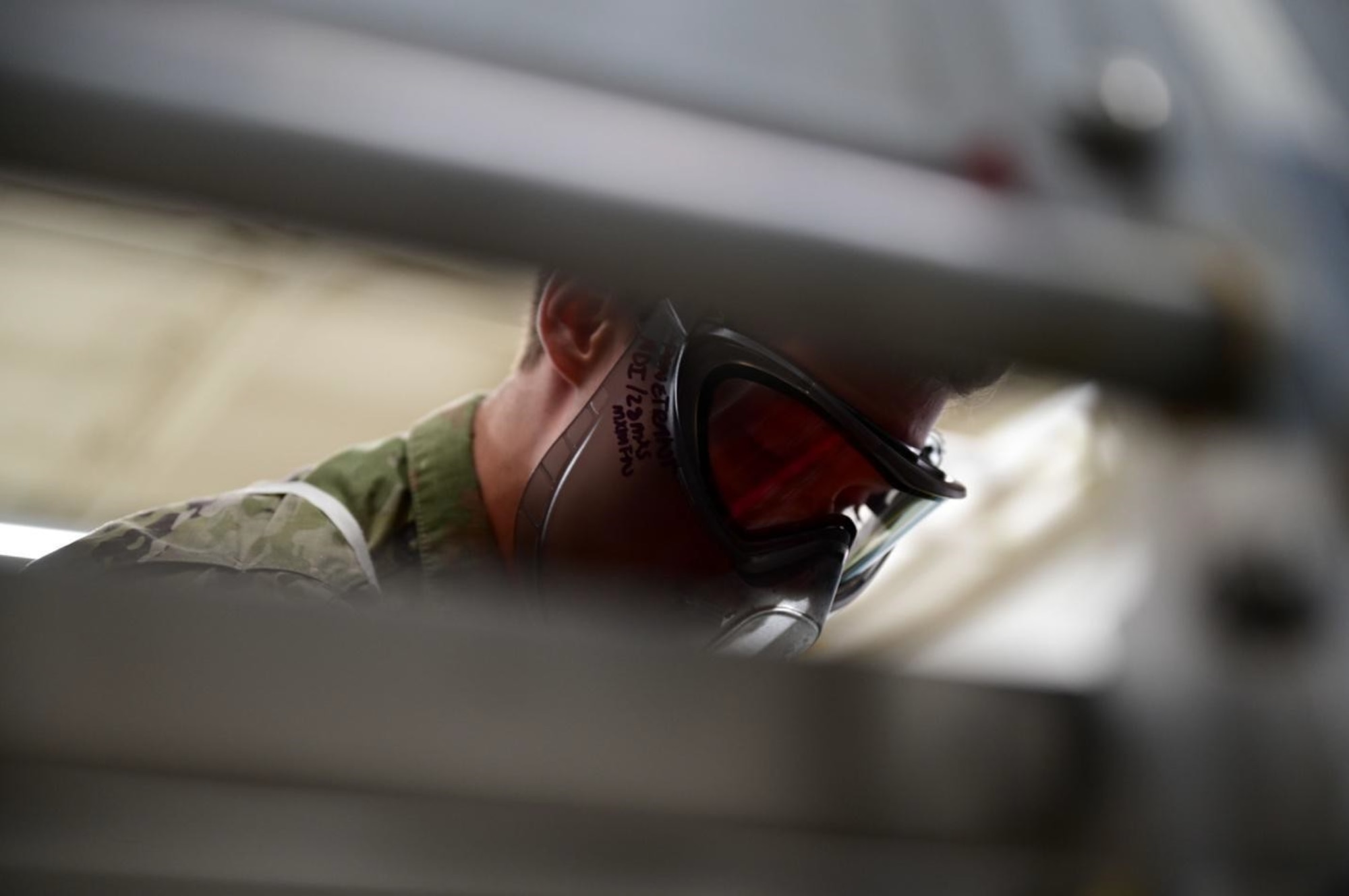 Airman 1st Class Brett Miska, a 28th Maintenance Squadron Fabrication Flight non-destructive inspection apprentice, provides a demonstration of the Fluorescent Penetrant Line within the NDI lab at Ellsworth Air Force Base, S.D., July 13, 2022.