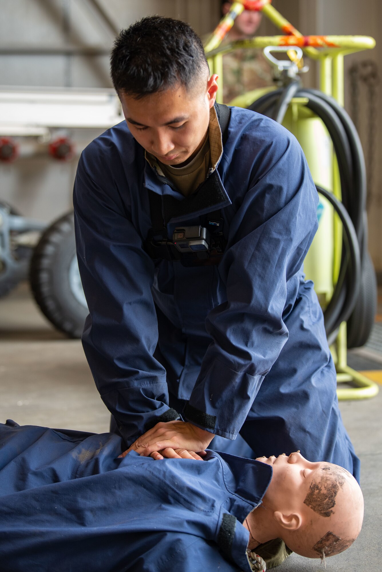People in uniform work on an aircraft