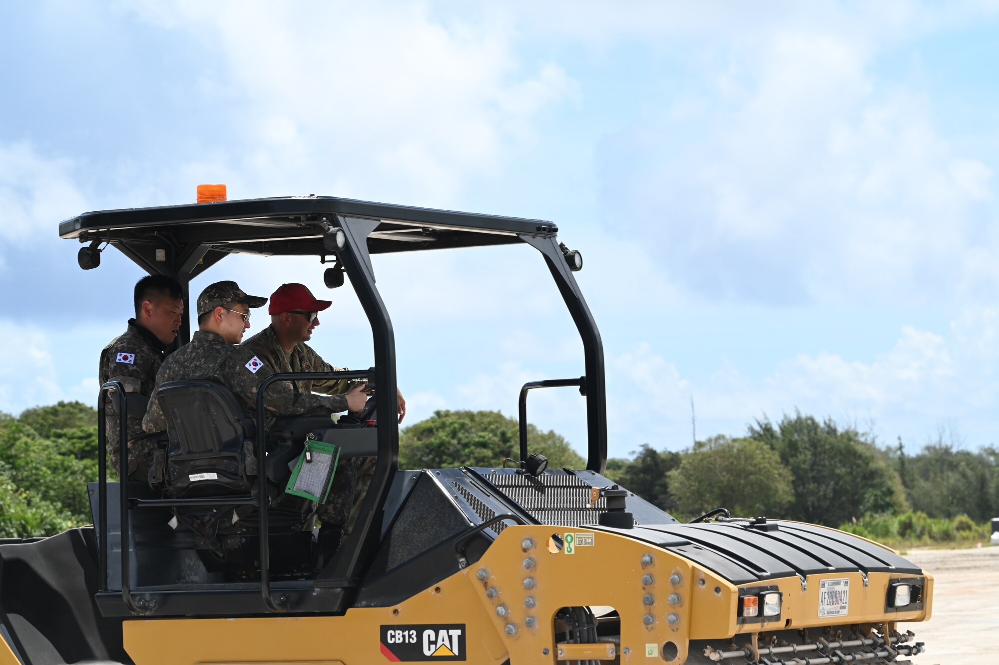 U.S. Air Force Master Sgt.  Arian Olomi, electrical contingency training NCO in charge assigned to 554th RED HORSE Squadron, train  Republic of Korea Airmen on heavy machinery during Silver Flag on Northwest Field, Guam, June 30, 2022.