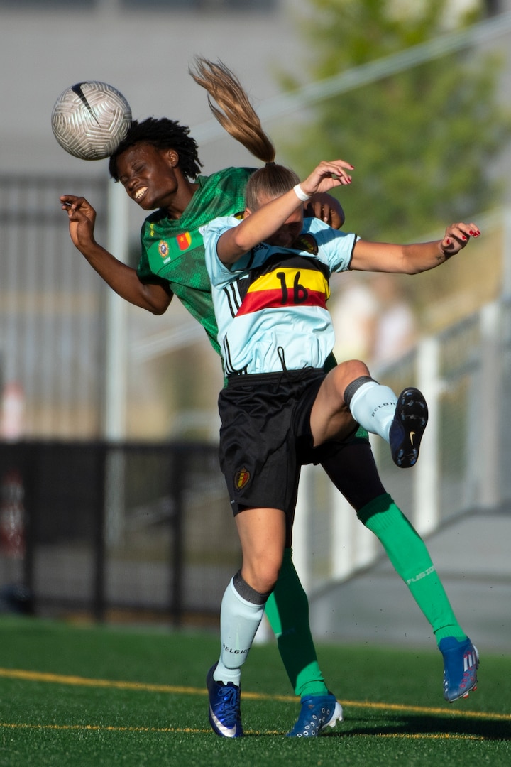 Cameroon’s Nkomidio A Mbassa heads a ball away from Belgium’s Elena Arnoldy during the 13th CISM (International Military Sports Council) World Military Women’s Football Championship in Meade, Washington July 19, 2022. (DoD photo by EJ Hersom)