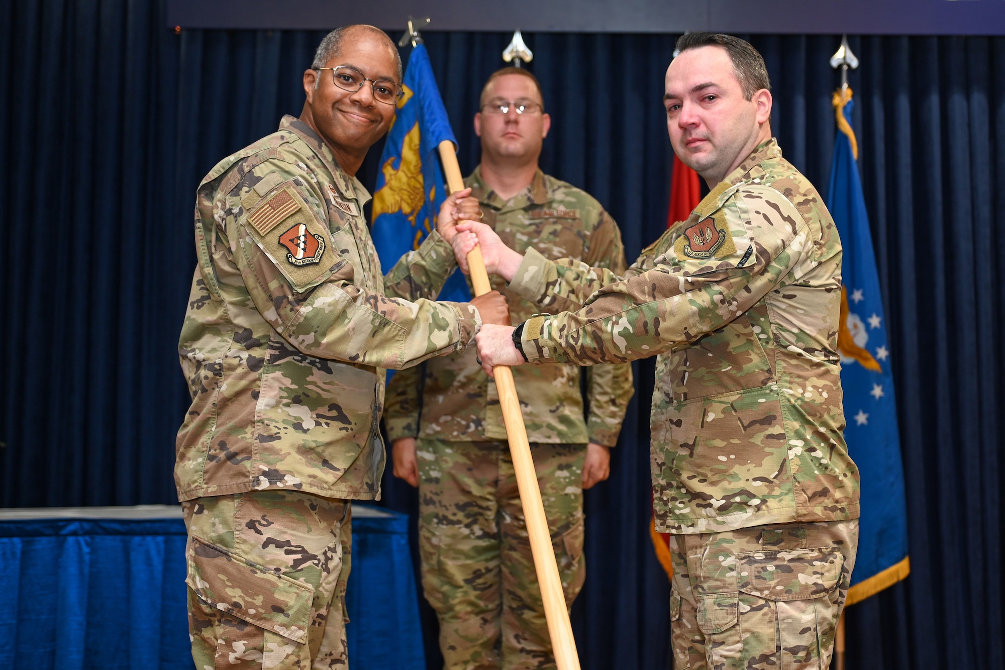 Maj. Daniel Jamerson (right), outgoing 39th Force Support Squadron commander, relinquishes the guidon to Col. Christopher Robinson, 39th Mission Support Group commander, during a change of command ceremony at Incirlik Air Base, Turkey, July 15, 2022.