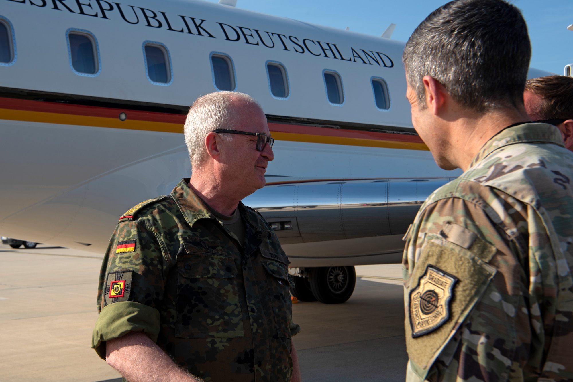 Col. Leslie Hauck, 52nd Fighter Wing commander and Col. William McKibban greet German Gen. Eberhard Zorn, Chief of Defense, at Spangdahlem Air Base, Germany, July 18, 2022. The 52nd FW works regularly with their NATO partners to strengthen bonds, secure common interests and promote shared values. (U.S. Air Force photo by Tech. Sgt. Anthony Plyler.)