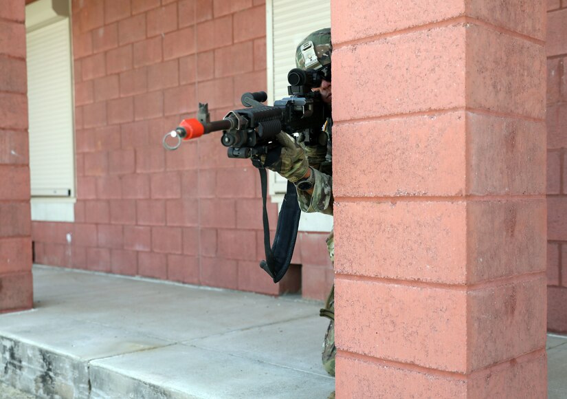 U.S. Army National Guard Spc. James Murphy, assigned to 160th Engineer Company, 721st Troop Command, 72nd Troop Command, uses pillars as cover and concealment during improvised explosive device response training on July 14, 2022 at Fort Indiantown Gap, Pa. The unit conducted annual training at the base during July.