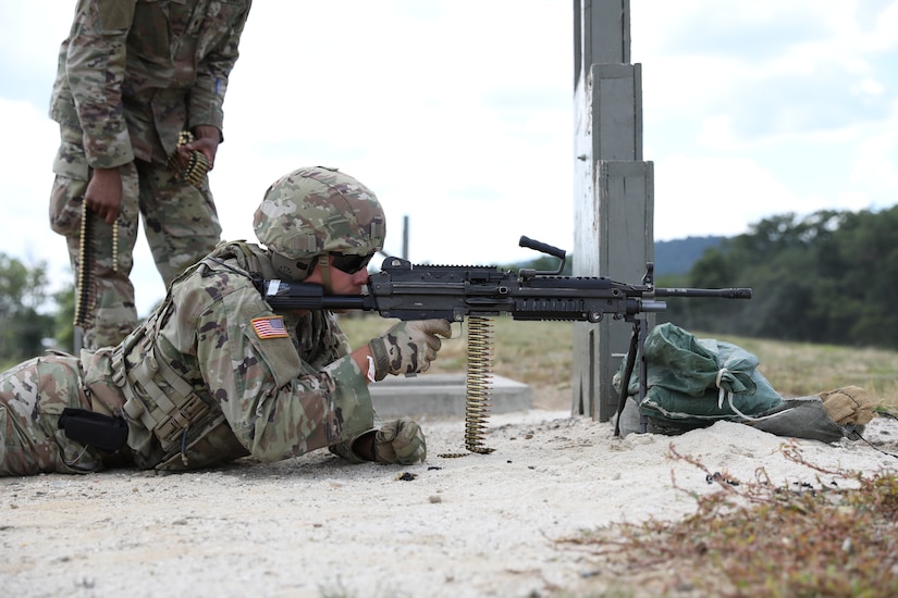 U.S. Army National Guard Spc. Robert Hanshaw of the 1069th Military Police Company, lies prone and ready to fire an M249 light machine gun during weapons qualification at Fort Indiantown Gap, Pa. July 13. (U.S. Army National Guard photo by Spc. John Trapani)
