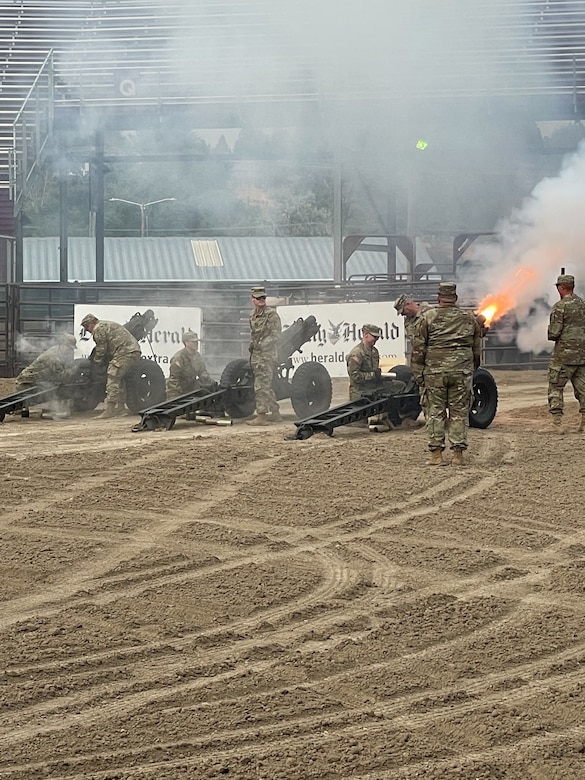 Soldiers perform a cannon salute