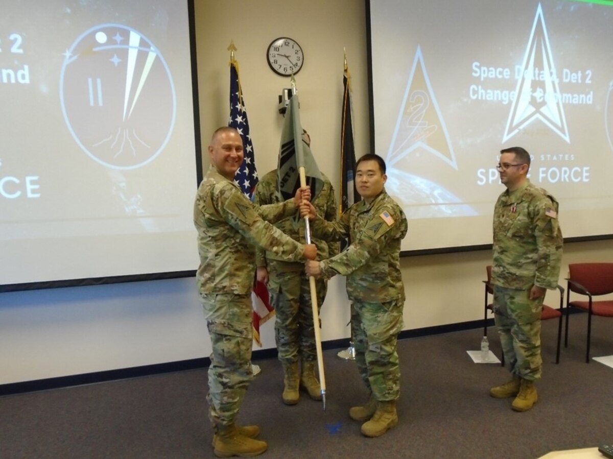 Maj. Jin Kim assumes command of the U.S. Space Force, Space Operations Command Space Delta 2, Detachment 2 from Space Delta 2 Commander Col. Marc Brock in a change of command ceremony July 7, 2022, at the Air Force Research Laboratory Directed Energy Directorate’s Starfire Optical Range at Kirtland AFB, New Mexico, while Maj. James Banta, the former Det. 2 commander looks on. (U.S. Air Force photo/Capt. Thomas W. Dickinson)