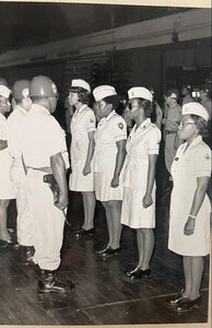 Medical Soldiers standing at attention in the D.C. Armory, 1960s.