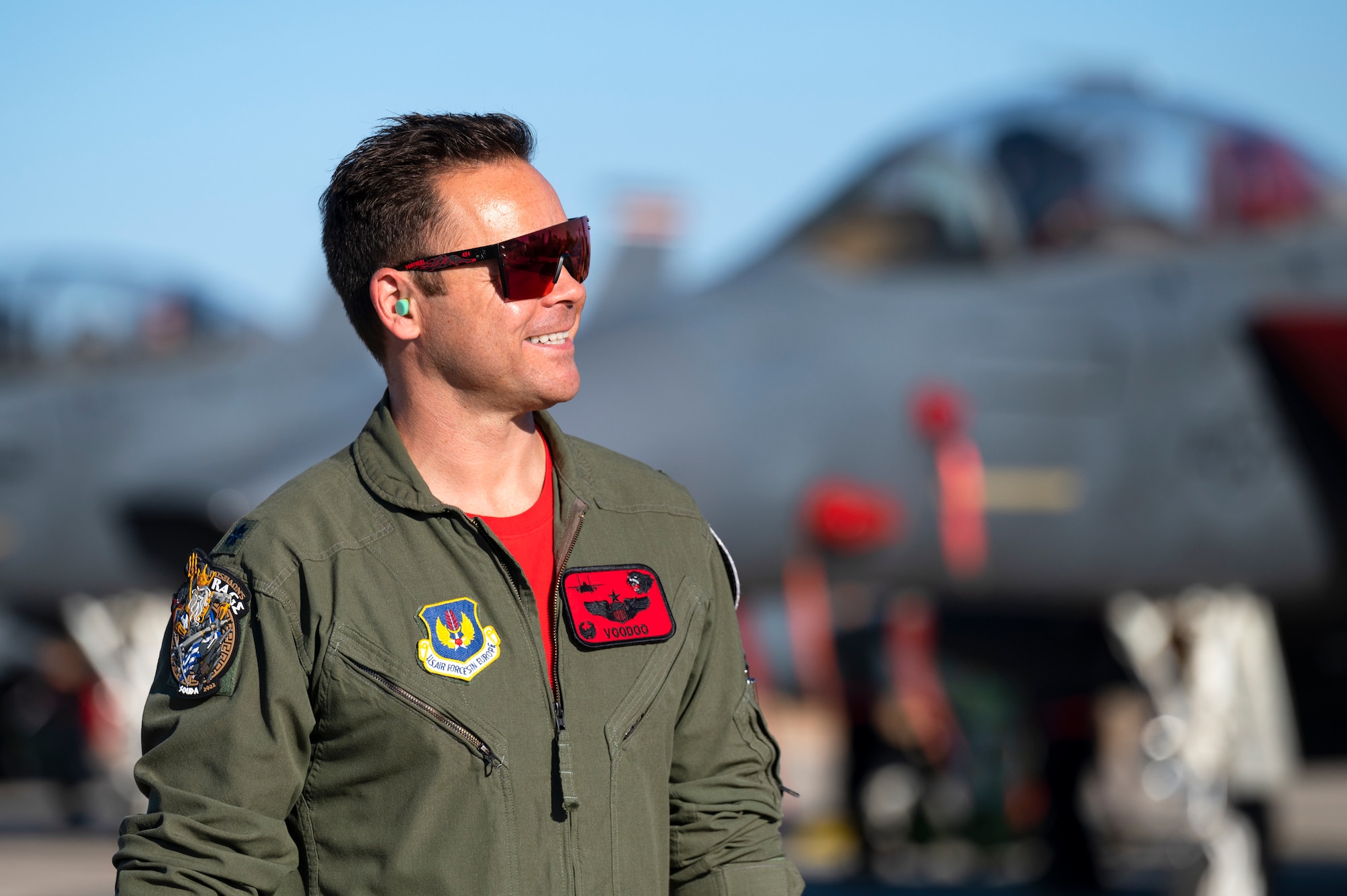 U.S. Air Force Lt. Col. Curtis Culver, 494th Fighter Squadron commander, smiles as he watches two F-15E Strike Eagles return after completing an Agile Combat Employment movement between combatant commands, at Souda Air Base, Greece, July 15, 2022. The 494 FS flew two Strike Eagles from Souda AB to an undisclosed location within the U.S. Central Command area of responsibility, where the aircraft landed, refueled and returned the same day. (U.S. Air Force photo by Tech. Sgt. Rachel Maxwell)