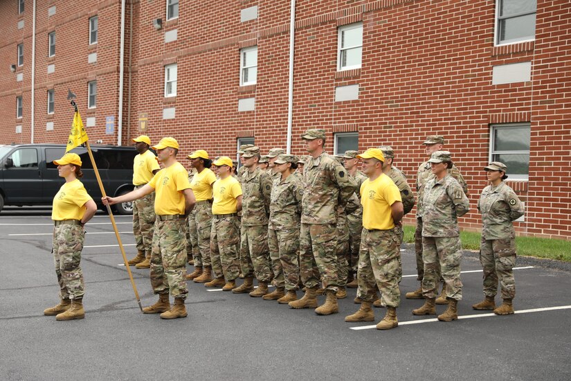 Warrant Officer Candidate Jolene Trout stands in front of a formation prior to the start of the sign, song and hat ceremony. This ceremony is a tradition that originated in the 1950s that marks the class's advancement to the next phase of WOCS.