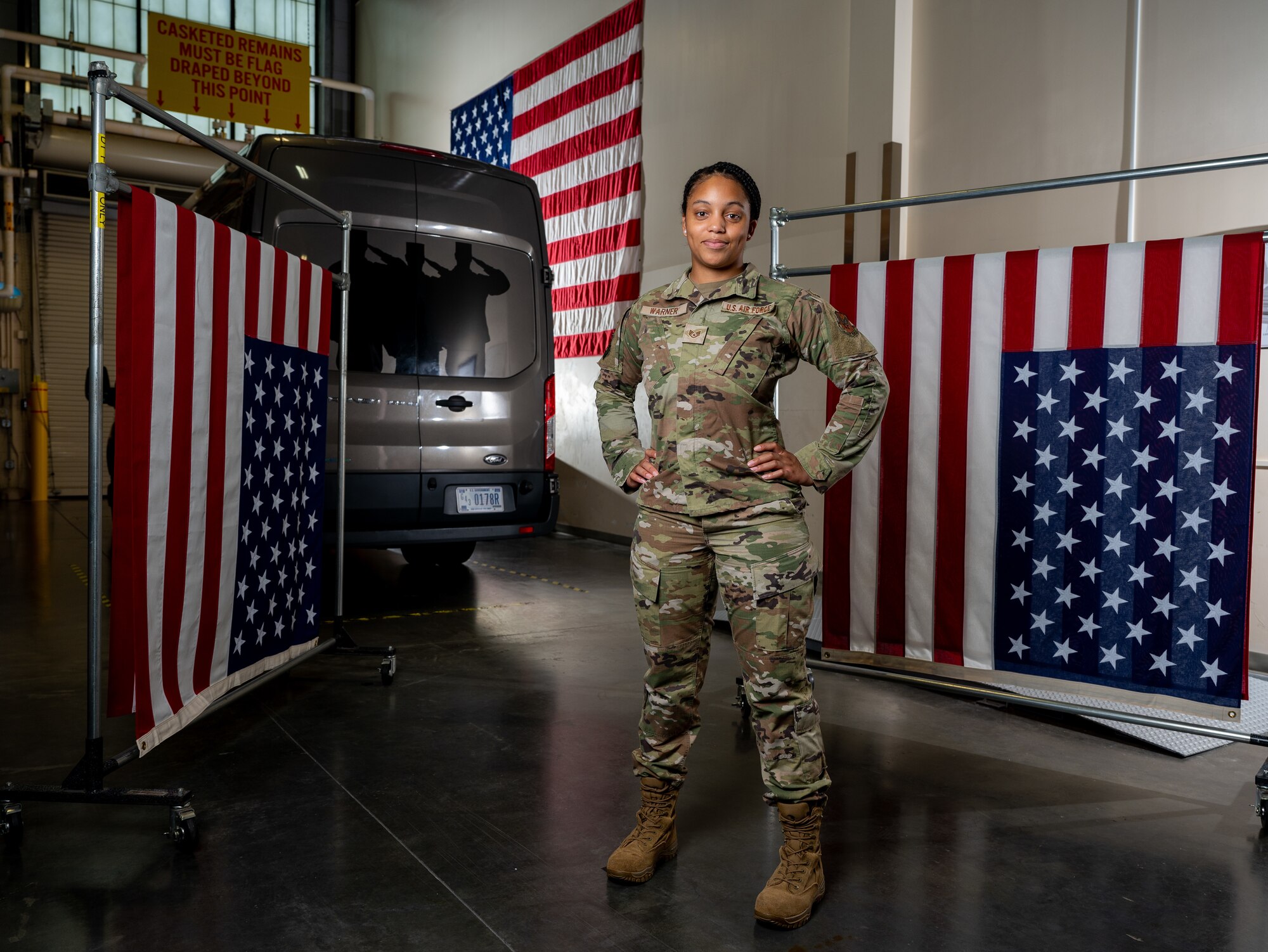 Staff Sgt. Zamiyah Warner, Air Force Mortuary Affairs Operations departures specialist, poses for a portrait in the AFMAO departures section at Dover Air Force Base, Delaware, July 14, 2022. Warner is a reservist deployed to AFMAO from the 512th Memorial Affairs Squadron.  (U.S. Air Force photo by Jason Minto)