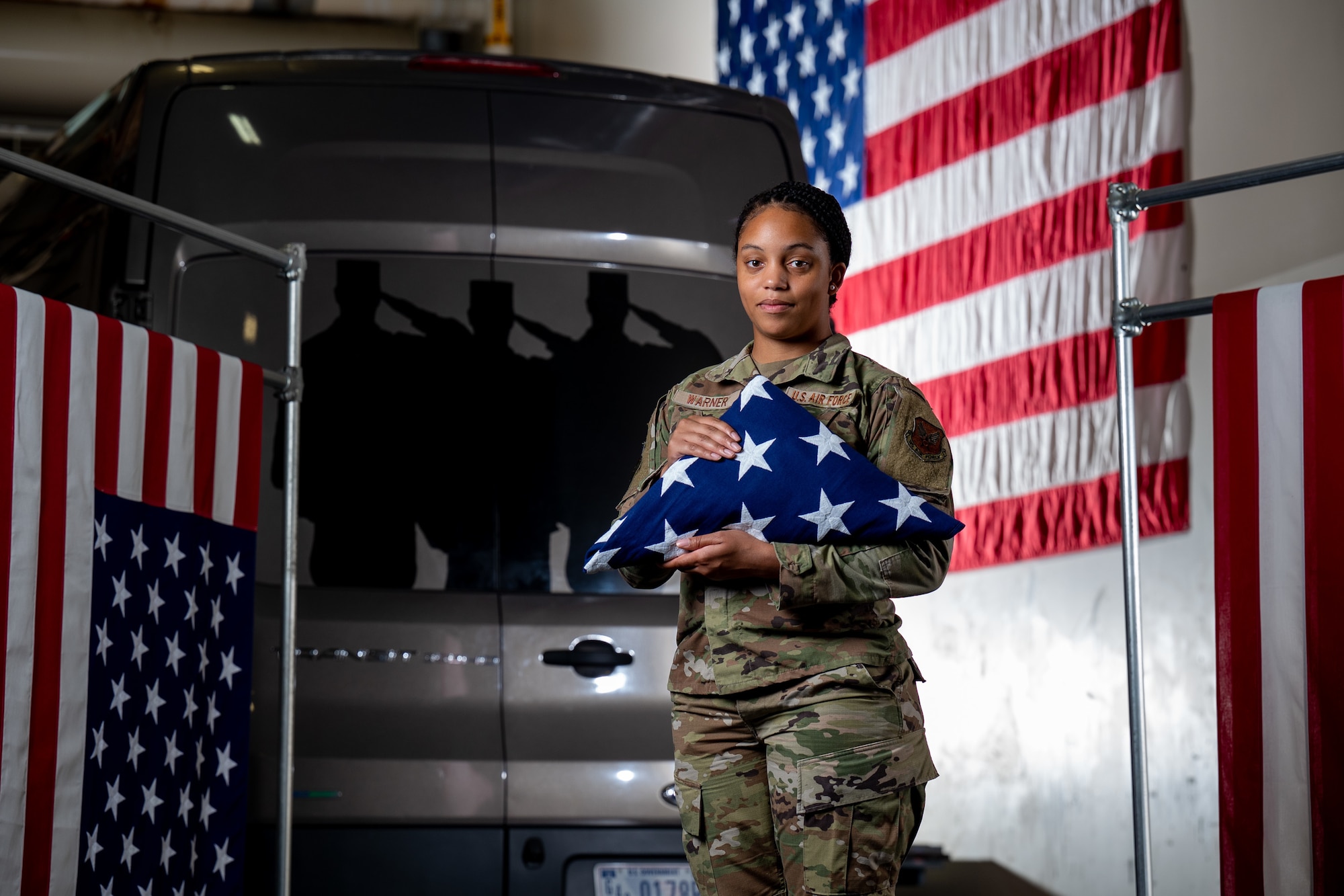 Staff Sgt. Zamiyah Warner, Air Force Mortuary Affairs Operations departures specialist, poses for a portrait in the AFMAO departures section at Dover Air Force Base, Delaware, July 14, 2022. Warner is a reservist deployed to AFMAO from the 512th Memorial Affairs Squadron.  (U.S. Air Force photo by Jason Minto)