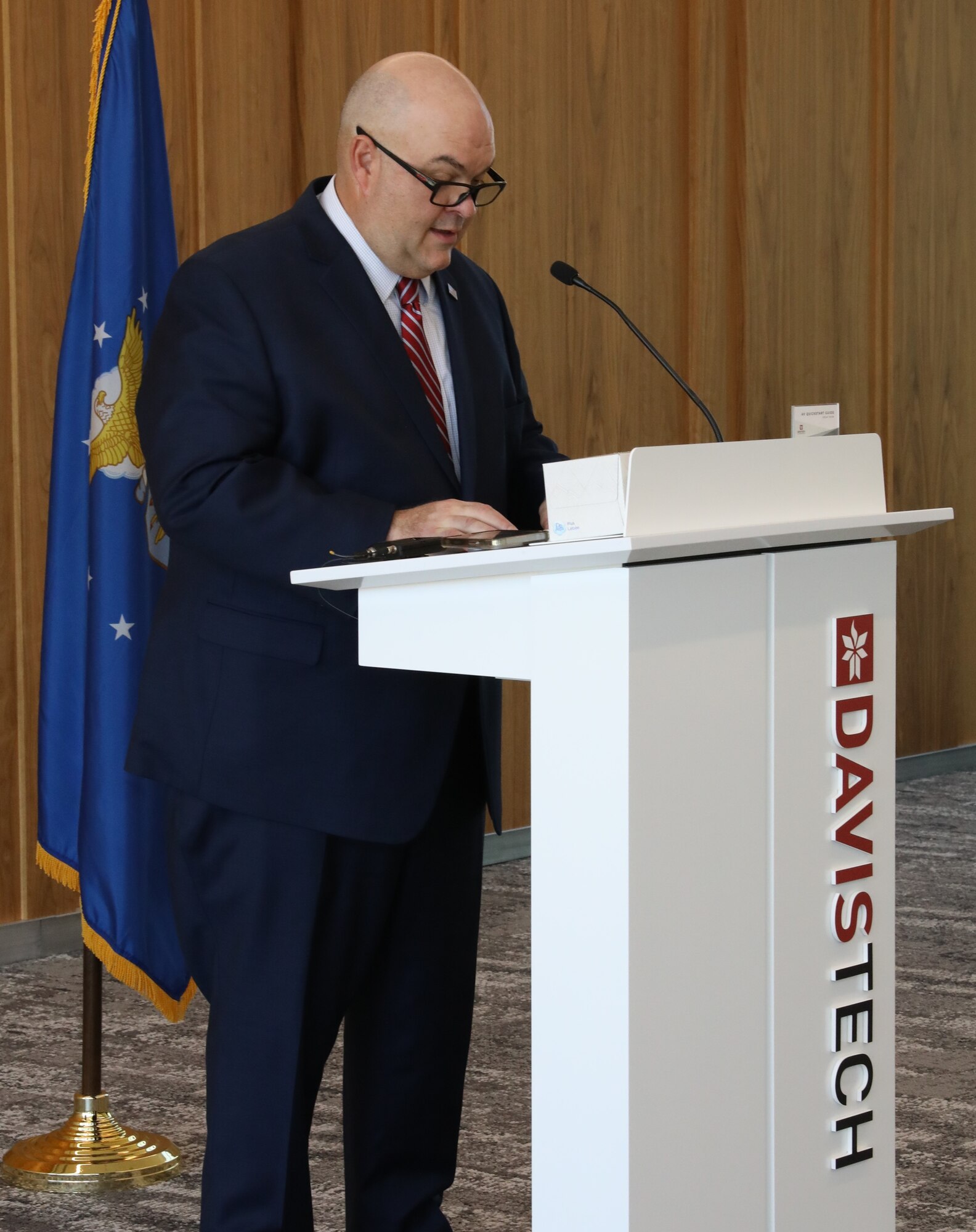 Davis Technical College president Darrin Brush speaks at Davis Tech before the ceremonial agreement signing that established customized formal training