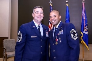 Chief Master Sgt. Erik Powell, right, shares a moment with OSI Command Chief Master Sgt. Gregg Gow, following Powell's promotion ceremony at Air Force Reserve Command Headquarters, Robins Air Force Base, Georgia, June 30, 2022. (Courtesy photo)