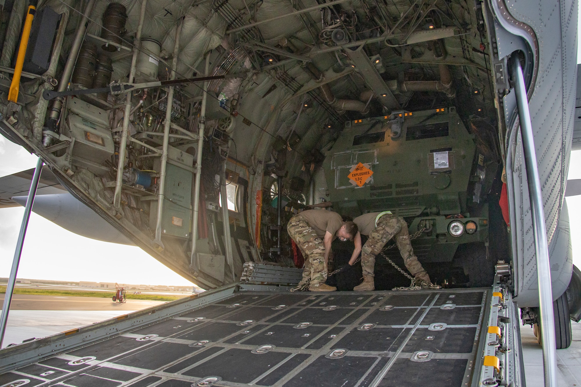 U.S. Air Force Airmen with Air National Guard, 133rd Airlift Wing, St. Paul, Minnesota, secure a U.S. Marine Corps High-Mobility Artillery Rocket System with 5th Battalion, 11th Marine Regiment, 1st Marine Division, on a C130 Hercules assigned to 133rd Airlift Wing, in support of exercise Valiant Shield 2022 at Andersen Air Force Base, Guam, June 7, 2022.