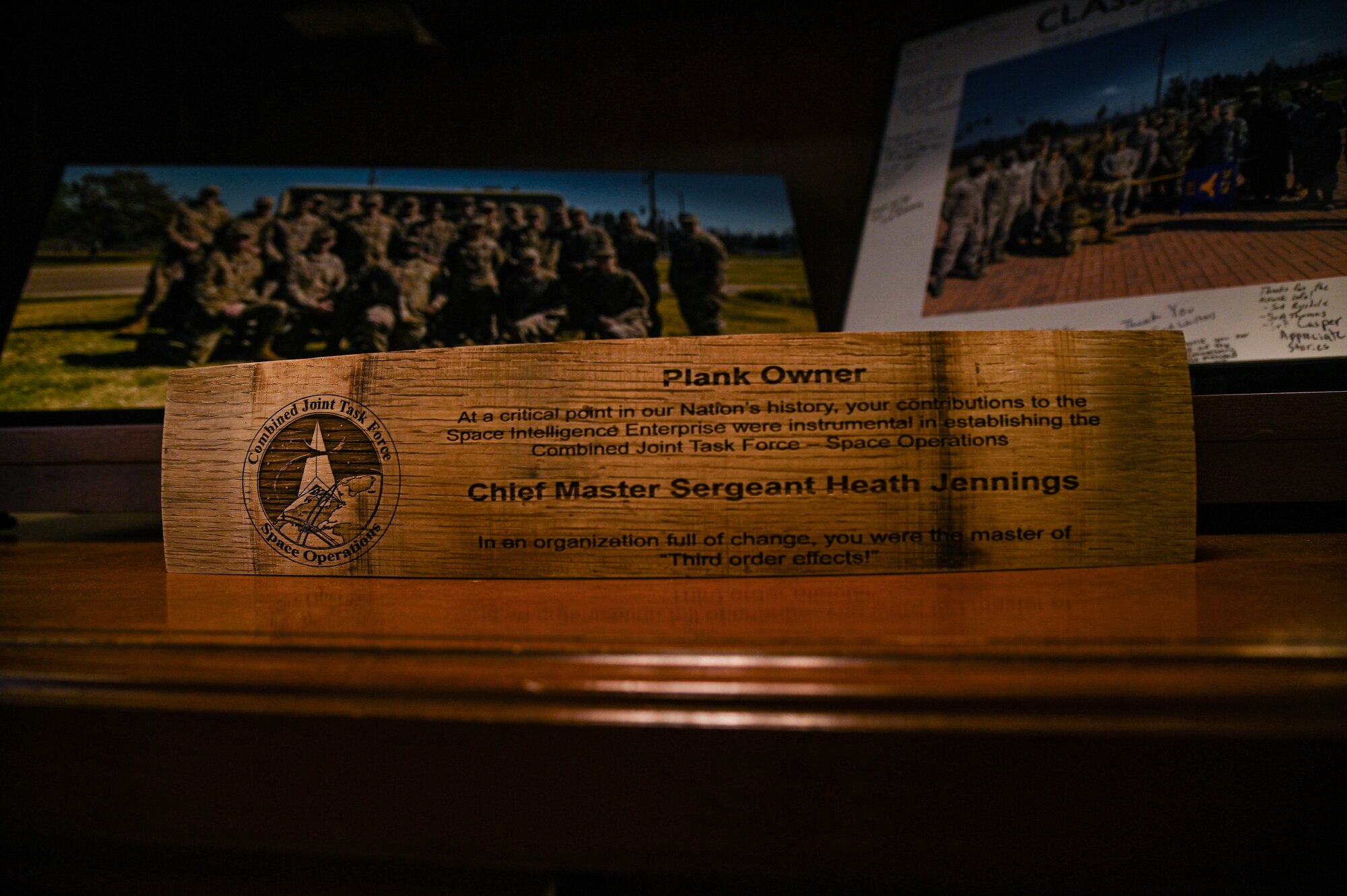 A plank commemorating Chief Master Sgt. Heath Jennings’ time as the Chief Enlisted Manager for the 14th Air Force, supervising intelligence Airmen across five wings supporting Air Force Space Command. Jennings held the enlisted manager position before becoming the Senior Enlisted Leader on Vandenberg.  (U.S. Space Force Photo by Airman 1st Class Ryan Quijas)