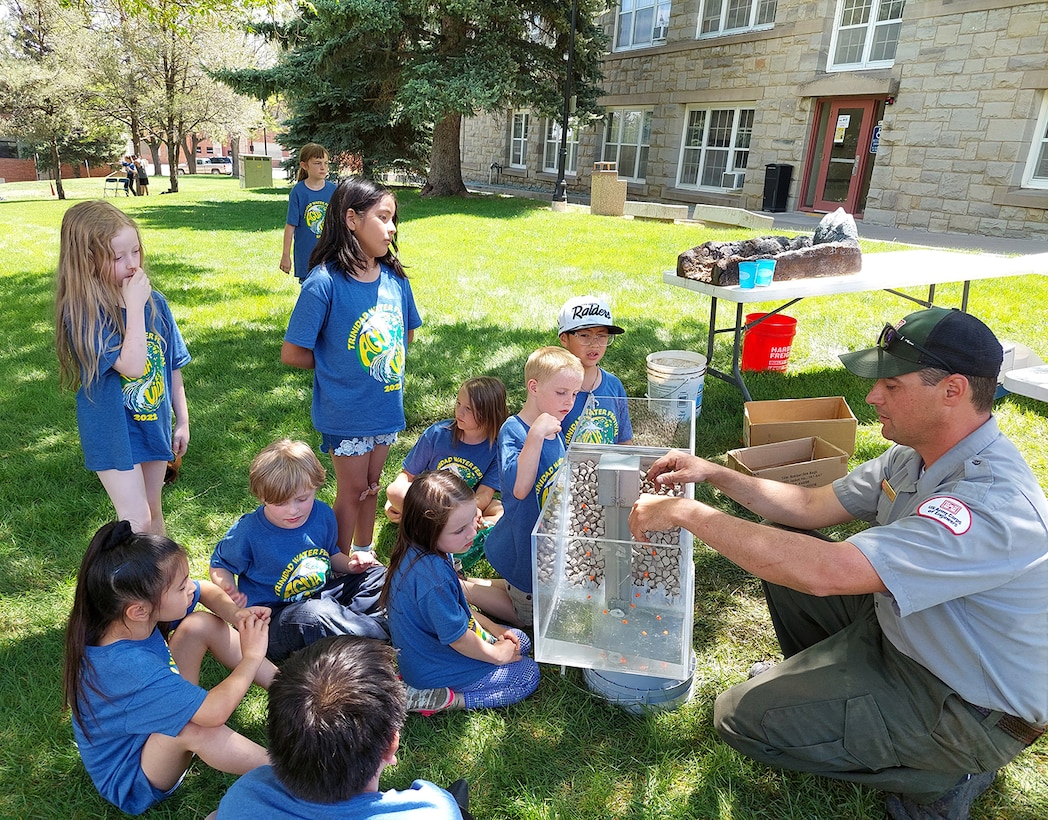 Trinidad Lake park ranger Kyle Sisco explains to students how the dam at Trinidad was built during the the annual water festival held at Trinidad State Junior College, May 17-18, 2022.