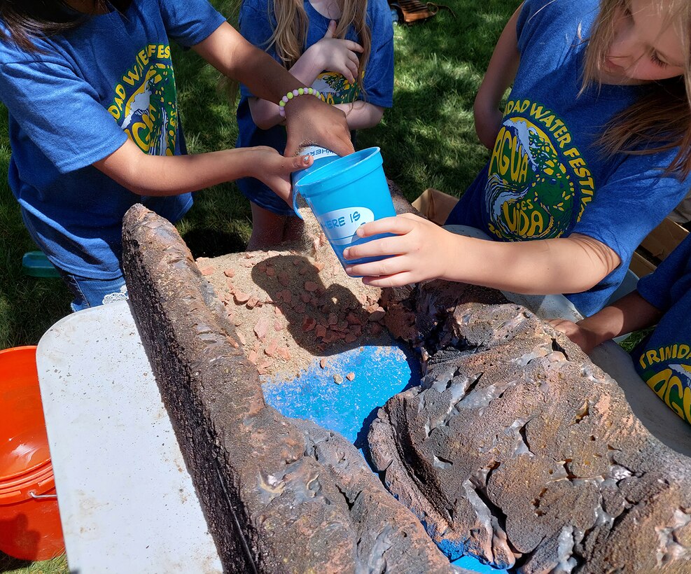 Students try building dams and competing with their classmates during the annual water festival held at Trinidad State Junior College, May 17-18, 2022.
