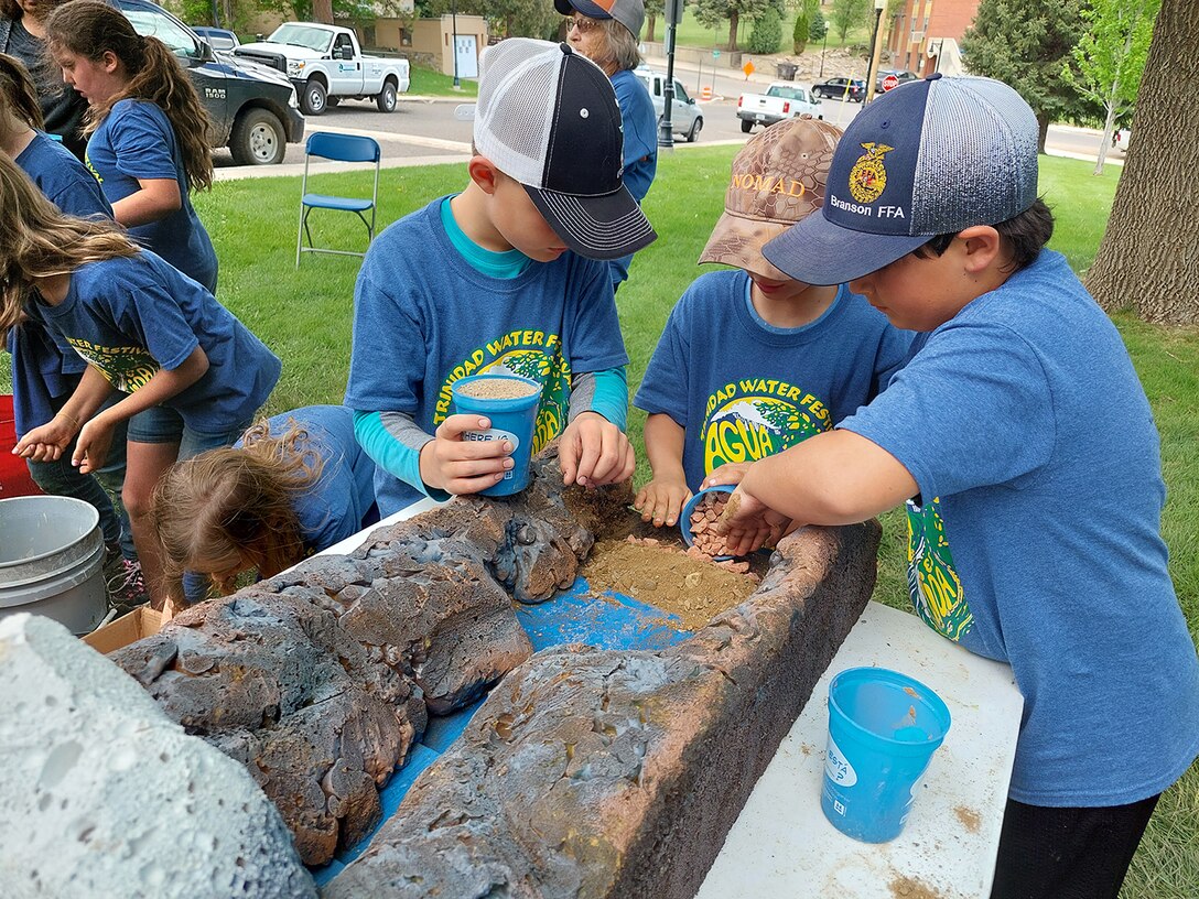 Students try building dams and competing with their classmates during the annual water festival held at Trinidad State Junior College, May 17-18, 2022.