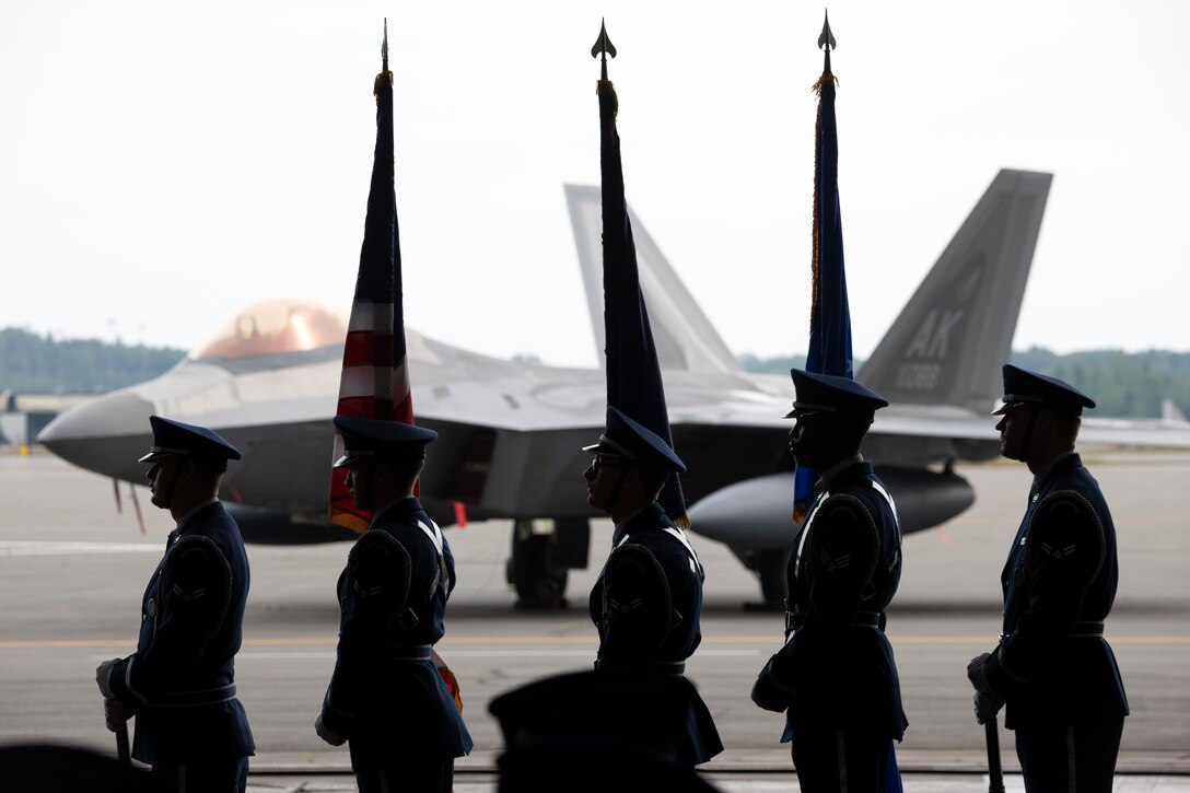 Honor guard stands in formation during change of command ceremony