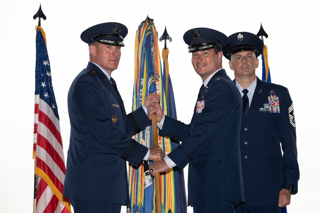 U.S. Air Force Col. Kevin M. Jamieson receives the colors from Lt. Gen. David Krumm