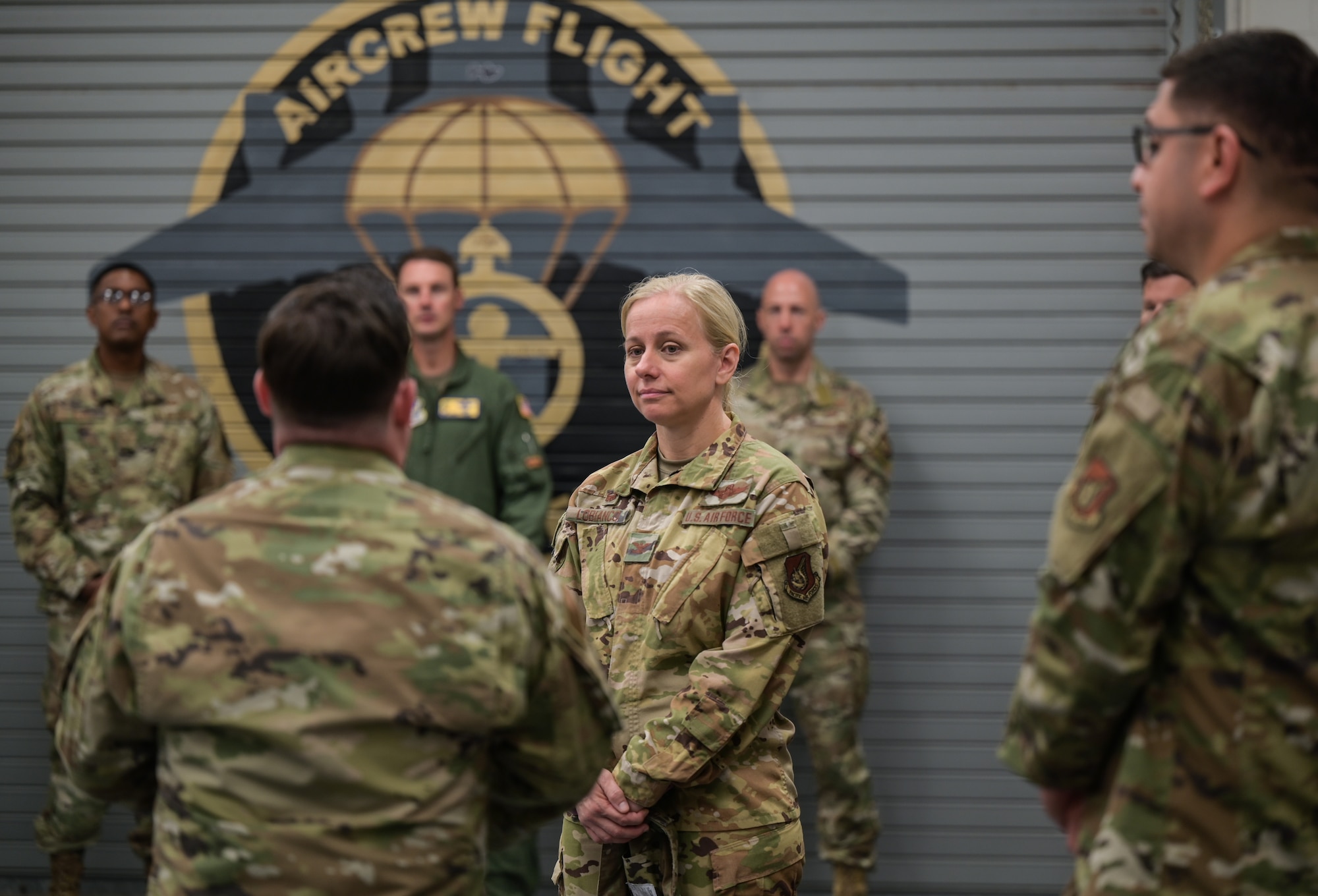 Col. Michele Lo Bianco, 15th Wing commander, is briefed by 15th Operations Support Squadron aircrew flight equipment members during a 15th Operations Group immersion tour at Joint Base Pearl Harbor-Hickam, Hawaii, July 19, 2022. During the immersion, Lo Bianco met with members of the 19th Fighter Squadron, 535th Airlift Squadron, 15th Operations Support Squadron and the 65th Airlift Squadron. (U.S. Air Force photo by Staff Sgt. Alan Ricker)