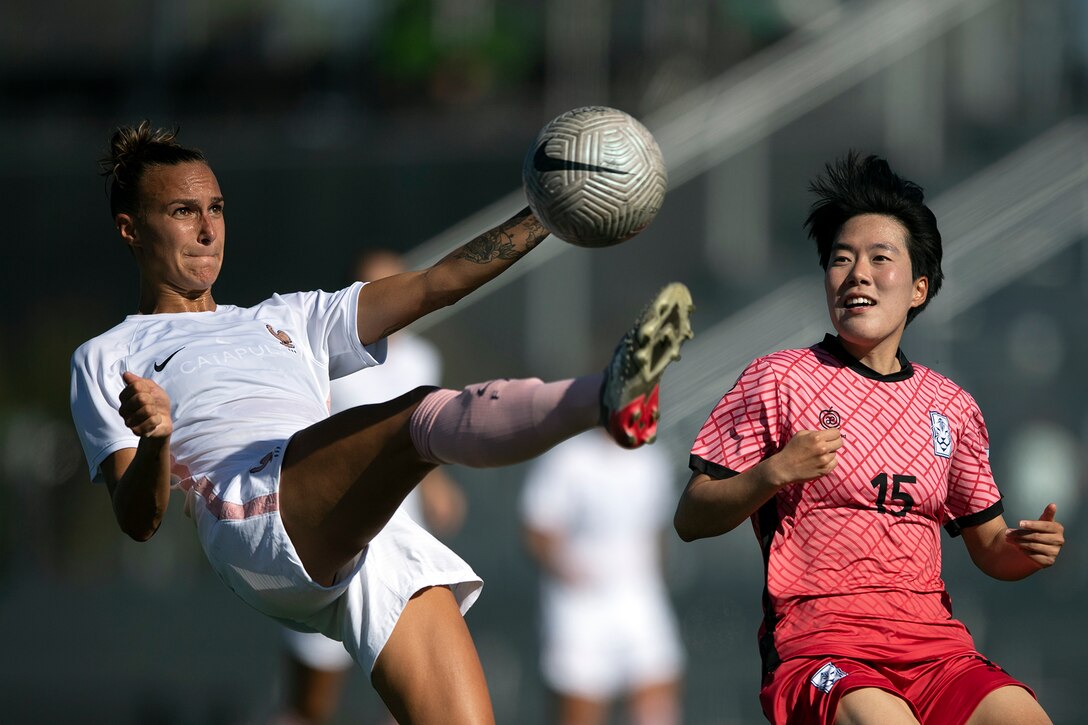France’s Vivian Boudaud keeps a ball away from South Korea’s Hyo Jeong Kim during the the 13th CISM (International Military Sports Council) World Military Women’s Football Championship in Meade, Washington July 20, 2022. (DoD photo by EJ Hersom)