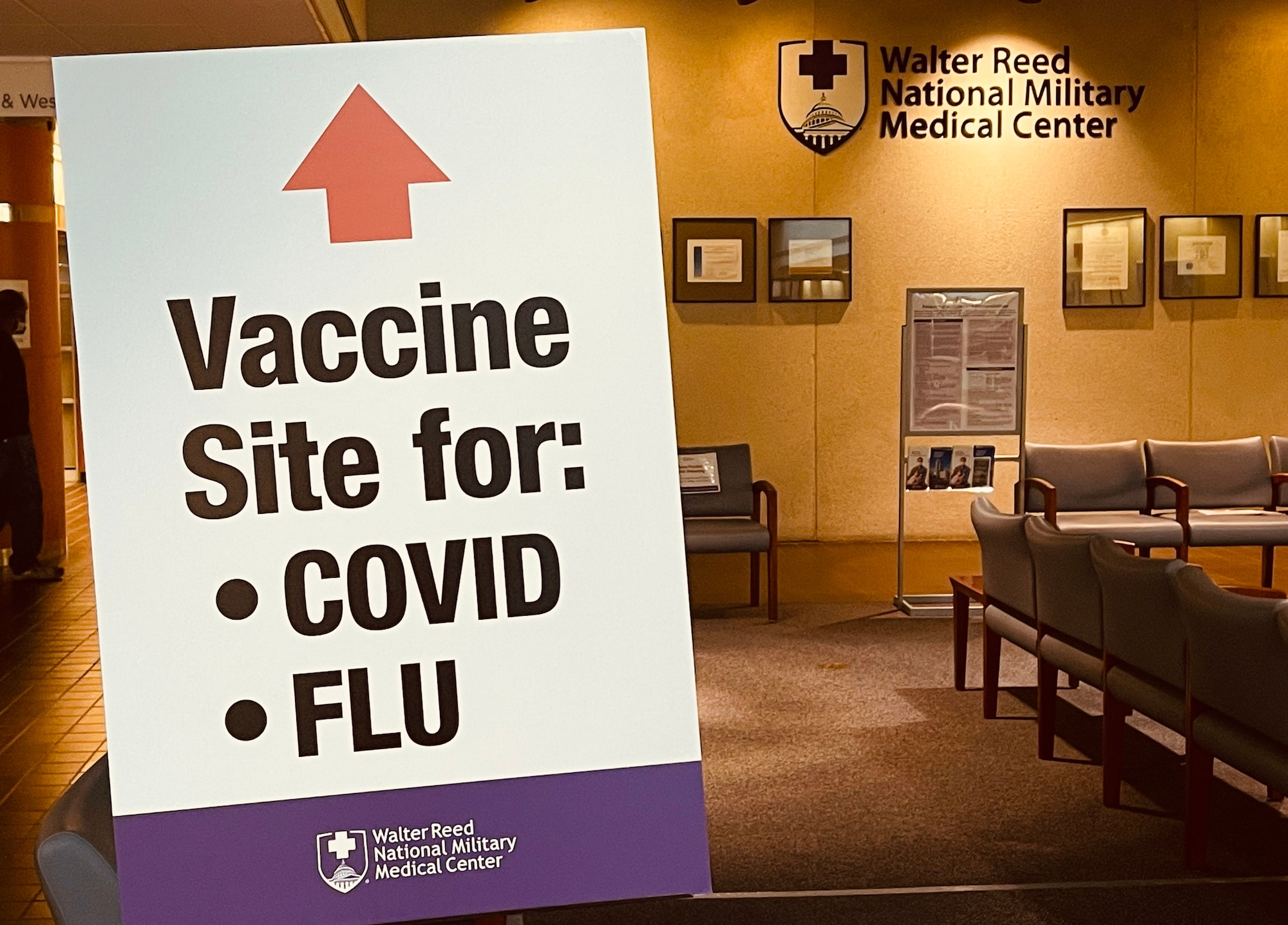 COVID-19 vaccination sign stands in Walter Reed National Military Medical Center, Bethesda, Maryland, Dec. 21, 2021. The sign reminds patients of areas to get their COVID-19 vaccine in the hospital.