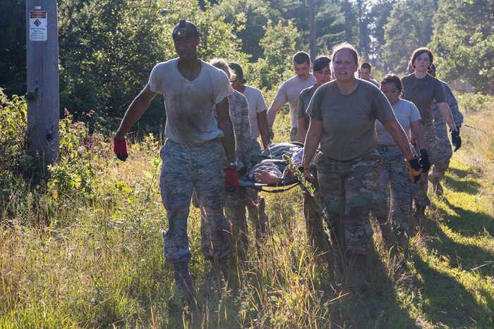 Reserve Citizen Airmen and British Royal Air Force members participate in a litter carry obstacle course at Fort McCoy, Wisconsin, Aug. 20, 2019 during exercise Patriot Warrior. Patriot Warrior is Air Force Reserve Command's premier exercise providing Airmen an opportunity to train with joint and international partners in airlift, aeromedical evacuation, and mobility support. The exercise builds on capabilities for the future fight, increasing the readiness, lethality and agility of the Air Force Reserve. (U.S. Air Force Photo by Staff Sgt. Christopher Dyer)