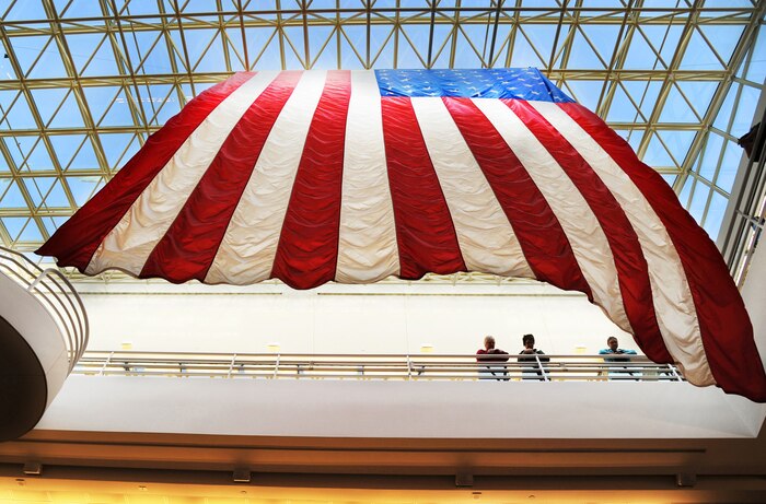 A giant flag flows gently above the 5th Medical Group facility at Minot Air Force Base