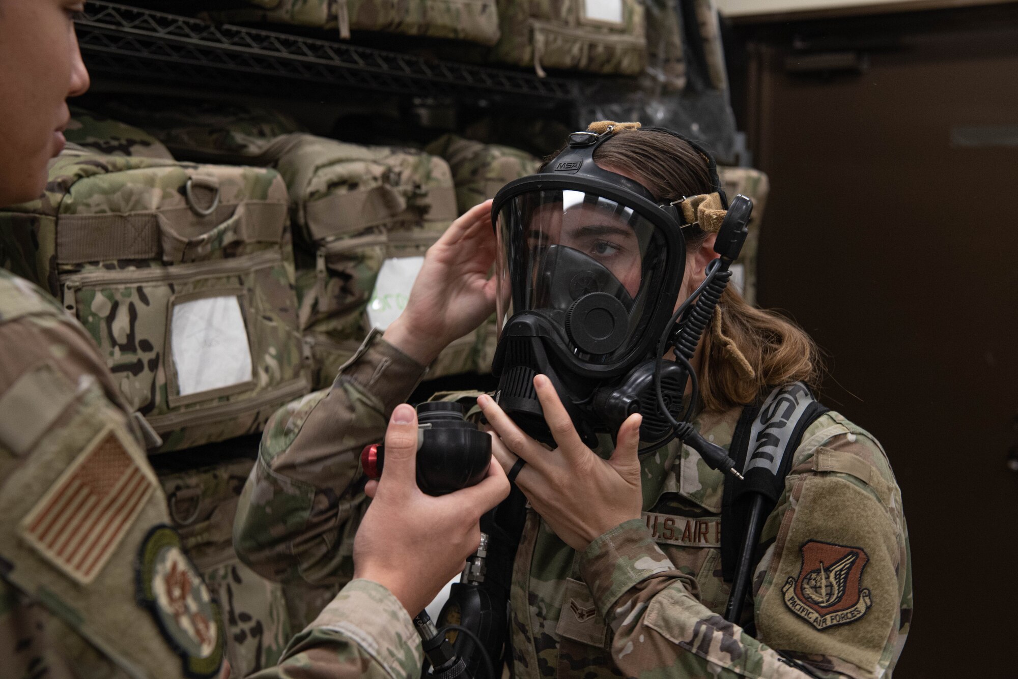 An Airman wears a breathing apparatus during an equipment test.