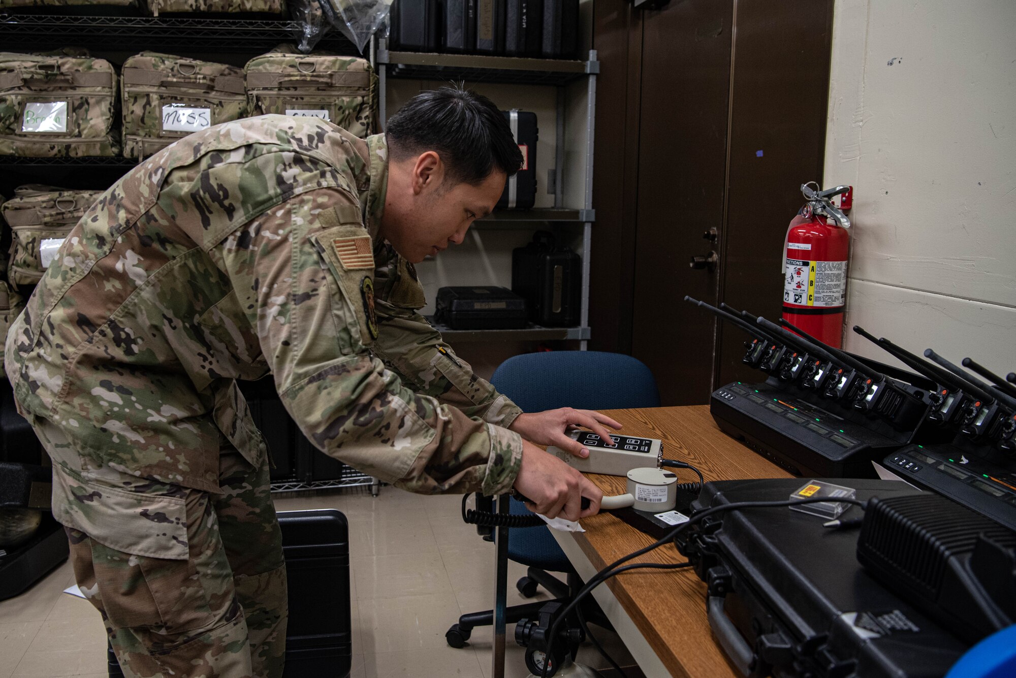 An Airman tests a radiation detection tool.