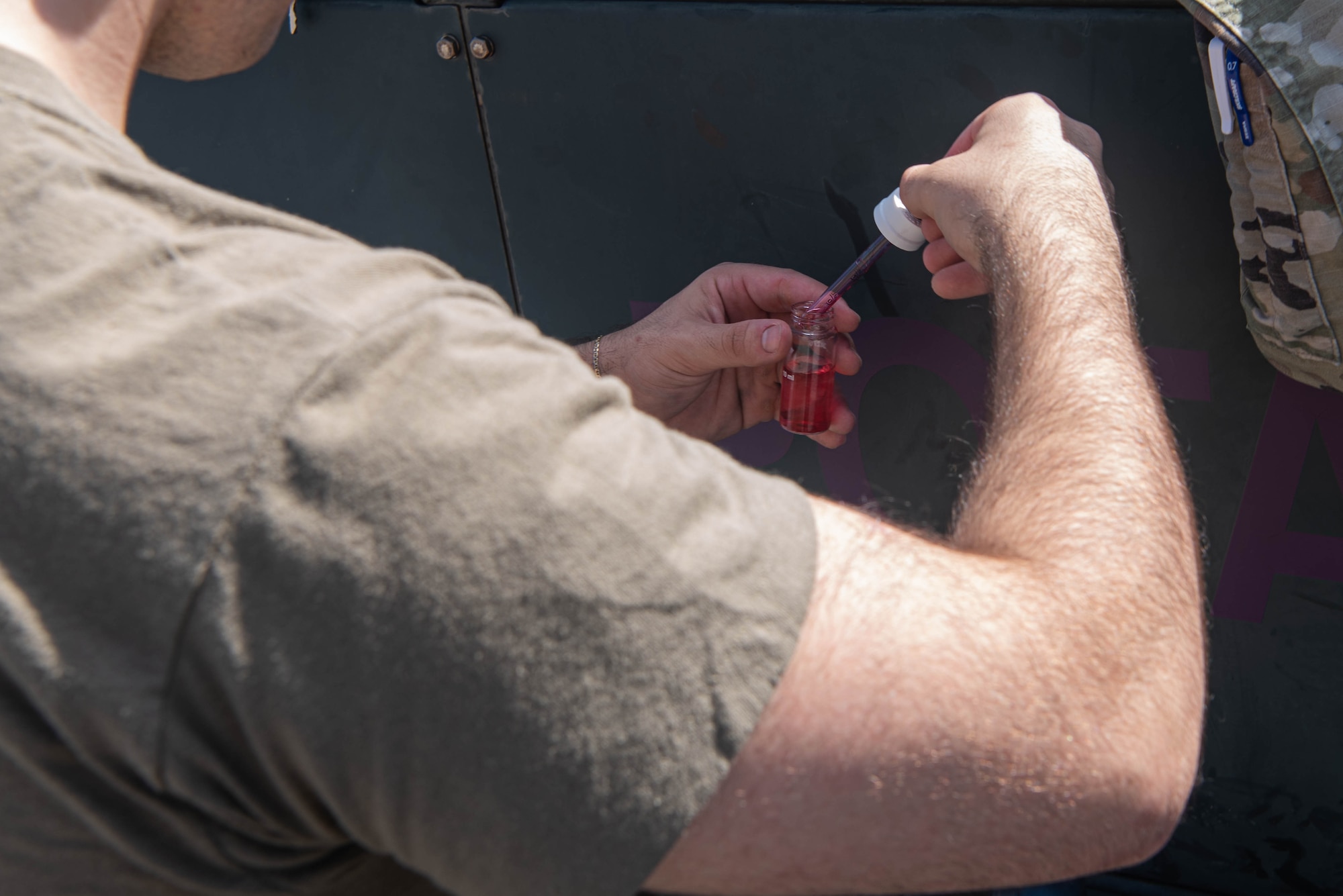 A pH indicator solution is added to a water sample.