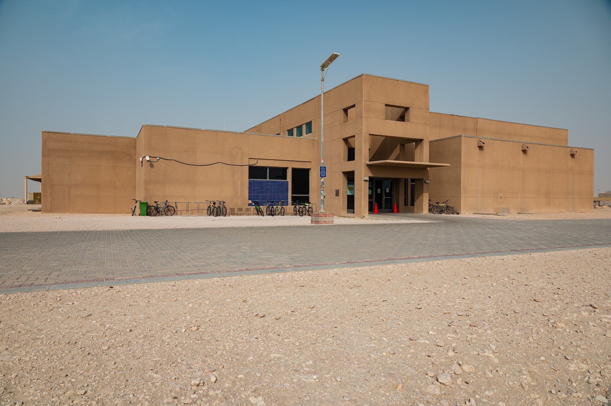 The Blatchford-Preston Complex Gym on Al Udeid Air Base, Qatar, 19 July 2022, is undergoing renovations both functional and aesthetic. The renovations have included a new rubberized track and a turf soccer field behind the gym with all renovations have been set to conclude April 2023. (U.S. Air Force photo by Staff Sgt. Dana Tourtellotte)