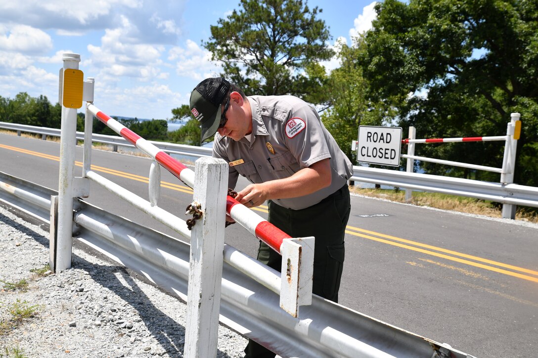 Josh Davis, Chief Ranger at the Walter F. George Resource Office, secures a road gate at Walter F. George, Georgia, July 6, 2022. Davis started his duties as Chief Ranger at Walter F. George in December 2021.