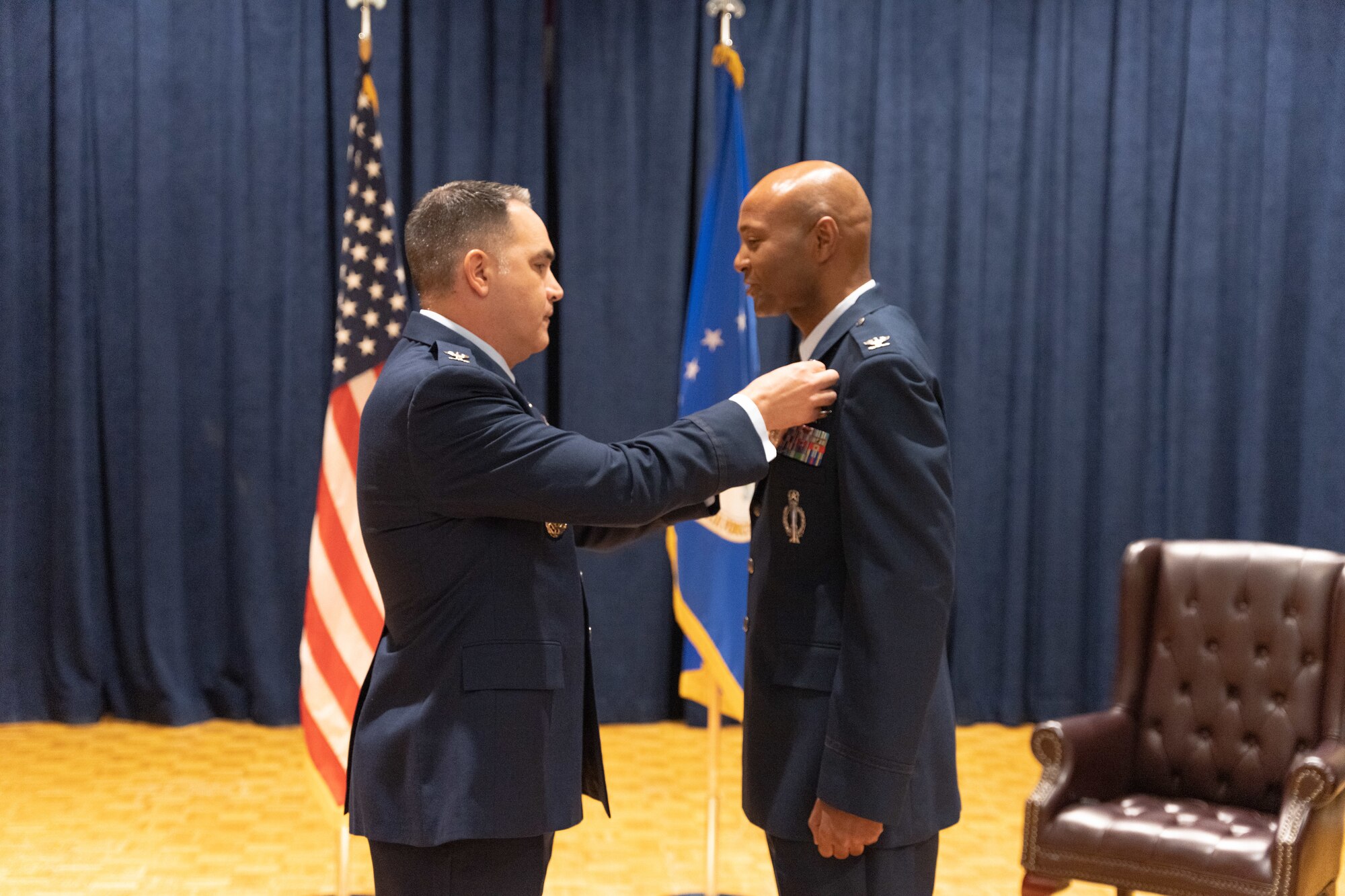 Officer pins on medal.