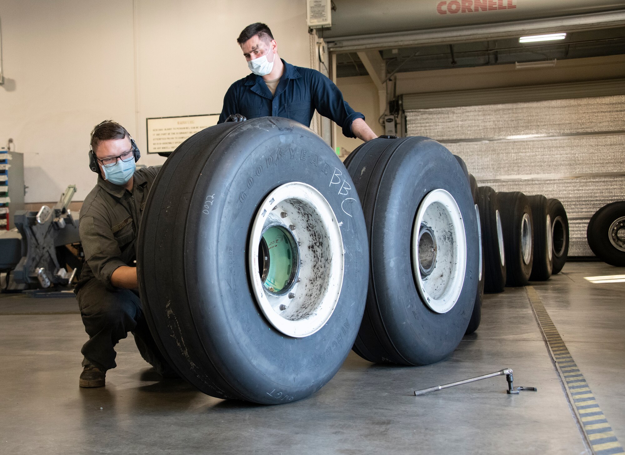 Airman fixing tires