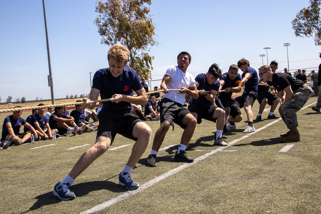 Future Marines with Recruiting Station Sacramento participate in the tug of war during a monthly pool function at Naval Air Station Lemoore in Lemoore, California, May 7, 2022. Pool functions are designed for future Marines to build camaraderie, improve fitness and learn leadership skills in preparation for recruit training. (U.S. Marine Corps photo by Cpl. Seaira Moore)
