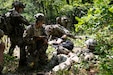 Massachusetts Army National Guard Soldiers assigned to Charlie Company, 1st Battalion, 181st Infantry Regiment, 44th Infantry Brigade Combat Team, perform combat lifesaver tasks during a situational training exercise July 19, 2022, at the 44th IBCT’s eXportable Combat Training Capability exercise at Fort Drum, New York. More than 2,500 Soldiers are participating in the training event, which enables brigade combat teams to achieve the trained platoon readiness necessary to deploy, fight  and win.