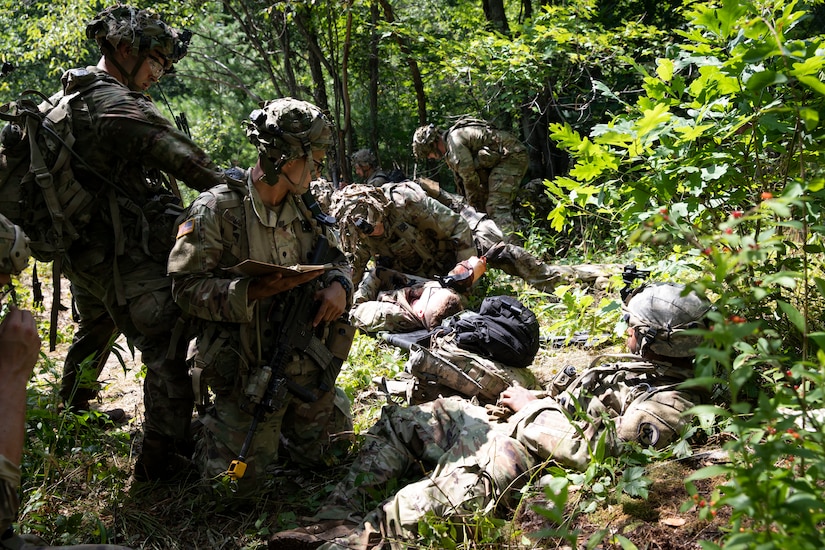 Massachusetts Army National Guard Soldiers assigned to Charlie Company, 1st Battalion, 181st Infantry Regiment, 44th Infantry Brigade Combat Team, perform combat lifesaver tasks during a situational training exercise July 19, 2022, at the 44th IBCT’s eXportable Combat Training Capability exercise at Fort Drum, New York. More than 2,500 Soldiers are participating in the training event, which enables brigade combat teams to achieve the trained platoon readiness necessary to deploy, fight  and win.