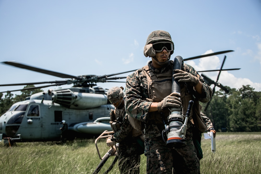 U.S. Marine Corps Cpl. Jehsel Maldonado, a bulk fuel specialist with 8th Engineer Support Battalion, Combat Logistics Regiment 27, 2nd Marine Logistics Group, refuels a CH-53K King Stallion during Summer Pioneer 2022 at Camp Lejeune, North Carolina, July 20, 2022. Summer Pioneer 2022 is a naval engineering exercise demonstrating integrated U.S. Marine Corps and U.S. Navy formations to establish and sustain Expeditionary Advanced Bases and Maritime Domain Awareness.