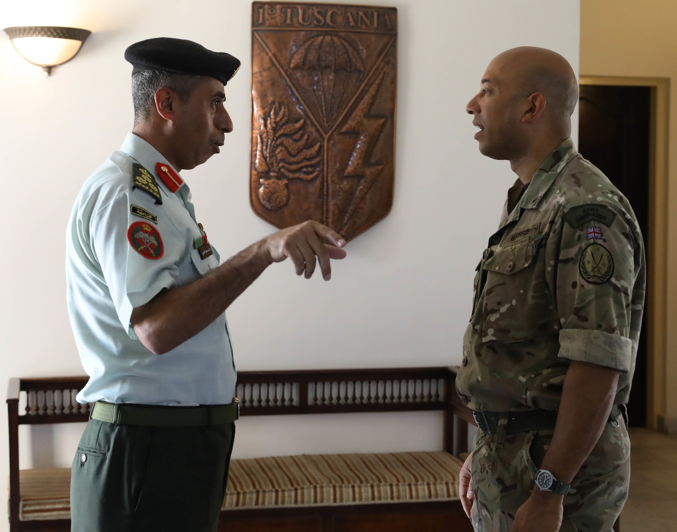 Jordanian Brig. Gen. Raed Saod Al-jbour, left, and British Army Brig. Karl Harris (right) talk before a defense attaché forum July 19, 2022, in Baghdad, Iraq. The defense attaché forum brought together defense attachés from several Global Coalition countries as well as representatives from Combined Joint Task Force - Operation Inherent Resolve (CJTF-OIR) and interagency partners to discuss topics including the need for increased repatriation and reintegration of displaced persons from northeast Syria to reduce ISIS influence in those vulnerable populations; the threat of ISIS members in detention centers operated by Syrian Democratic Forces in northeast Syria; and the need for greater international action to address these ongoing security and humanitarian challenges. Al-Jbour is the Defense Attaché from Jordan. Harris is the deputy commanding general of CJTF-OIR. (U.S. Army photo by Sgt. Brian Reed)