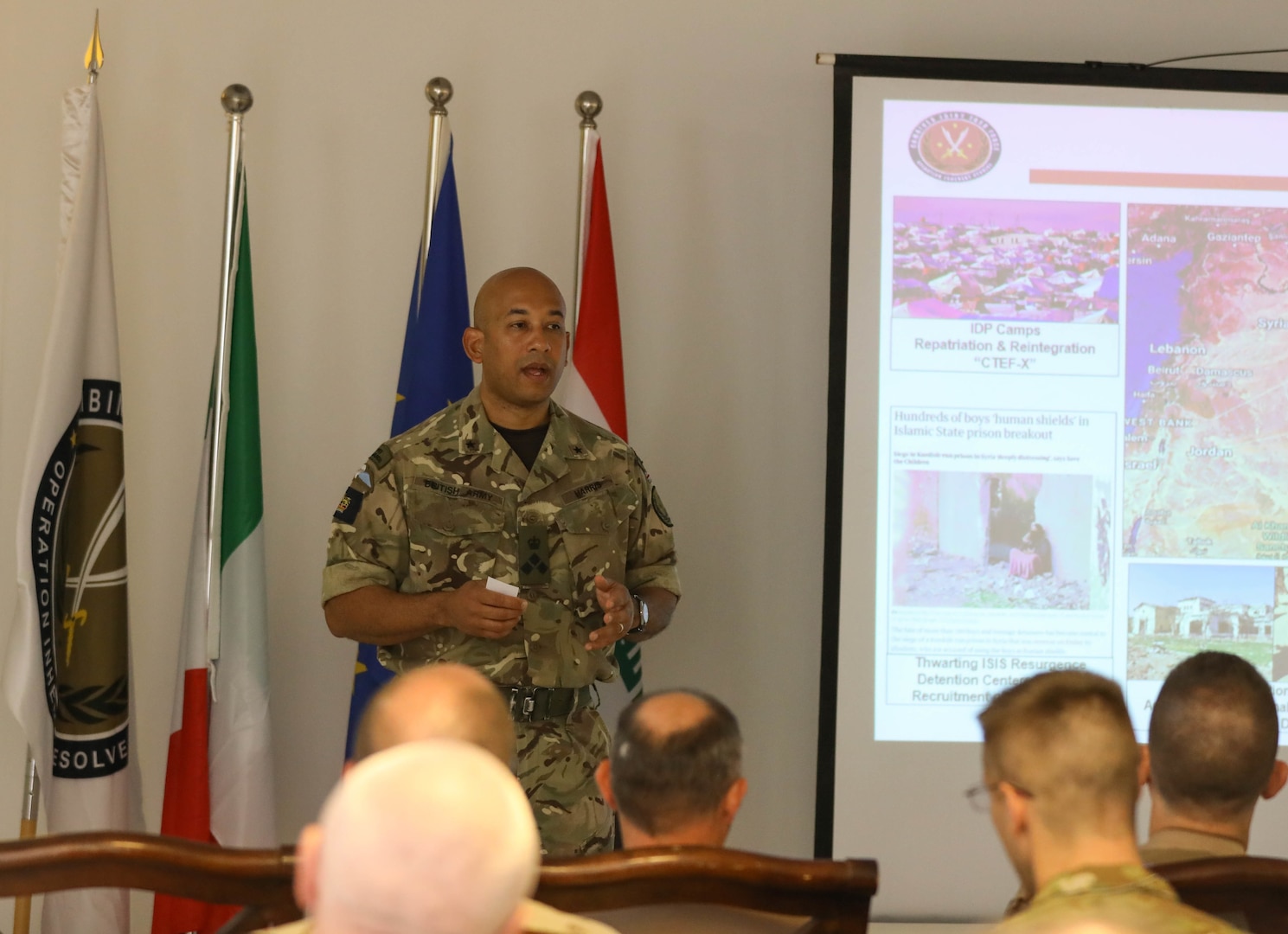 British Brig. Gen. Karl Harris, the deputy commanding general of Combined Joint Task Force - Operation Inherent Resolve (CJTF-OIR),  gives opening remarks  at a defense attaché forum July 19, 2022. The defense attaché forum brought together defense attachés from several Global Coalition countries as well as representatives from CJTF-OIR and interagency partners to discuss topics including the need for increased repatriation and reintegration of displaced persons in northeast Syria to reduce ISIS influence in those vulnerable populations; the threat of ISIS members in detention centers operated by Syrian Democratic Forces in northeast Syria; and the need for greater international action to address these ongoing security and humanitarian challenges. (U.S. Army photo by Sgt. Brian Reed)